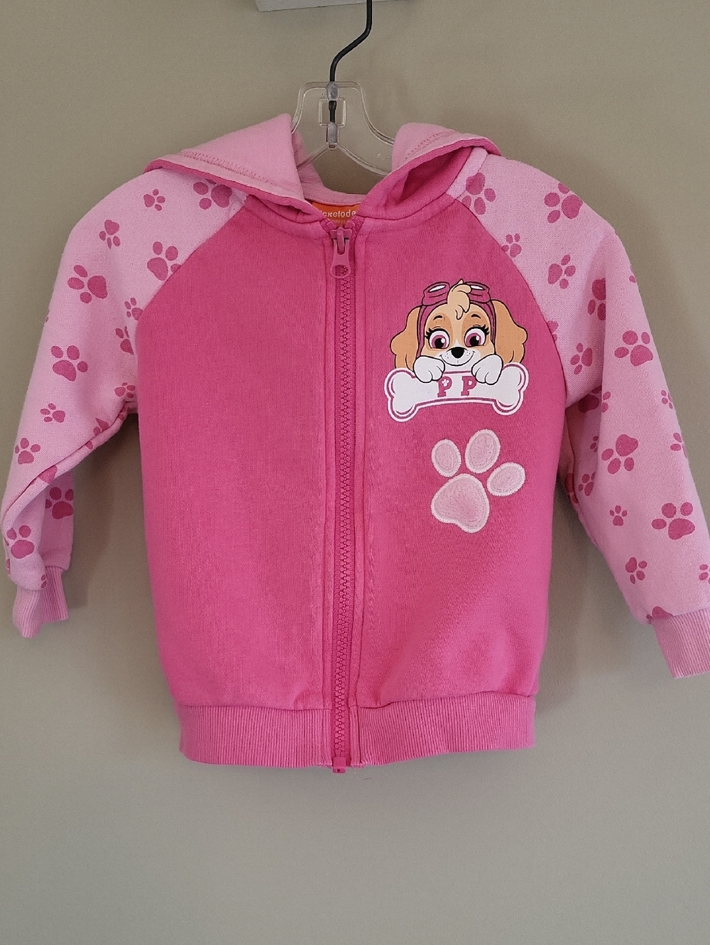 Paw Patrol Skye pink zip up hoodie with paw print sleeves